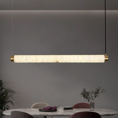 Des lumières suspendues en alabaster naturel à cylindre long créatif de concepteur minimaliste moderne