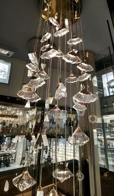 Lustre en cristal de luxe en forme de ventilateur, haut plafond, longue échelle, lustre pour la décoration familiale d'hôtels.